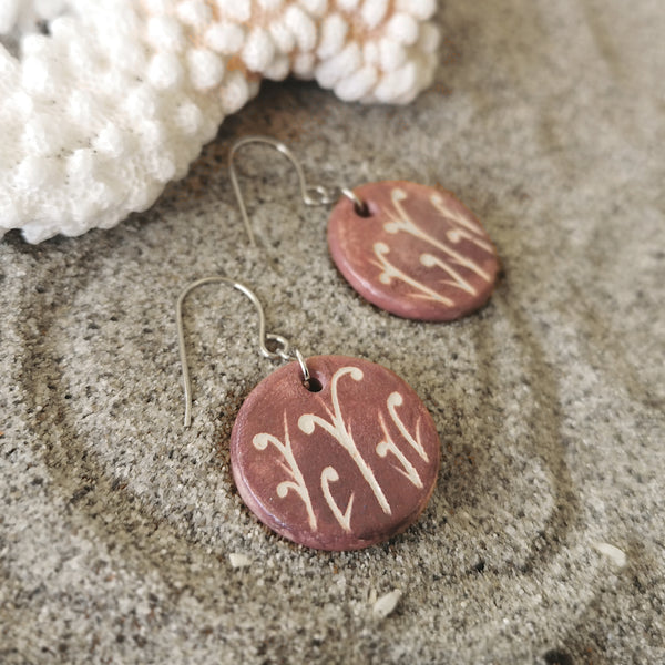 Hand-painted ceramic earrings with small pattern