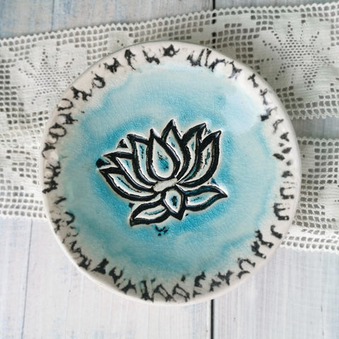 Turquoise ceramic bowl with lotus flower pattern